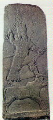 Assyrian relief of storm-god Adad (Louvre, Paris) 800 B.C.